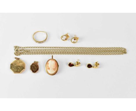 A collection of 9ct gold jewellery comprising a chain link necklace, two pairs of stud earrings, a ring set with white stones