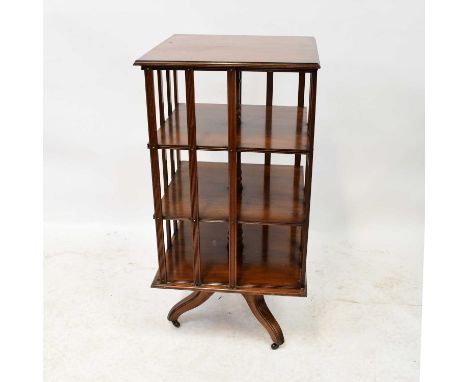 An Edwardian mahogany revolving bookcase raised on four outswept supports to castors, 108 x 53 x 53cm.Condition Report: Overa