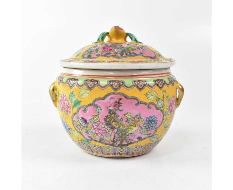 A Chinese Famille Jaune lidded jar, the interior painted with carp, the exterior with cartouches of pheasants within peonies,