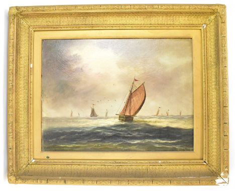 W. THOMAS; a 19th century oil on canvas seascape depicting sail barges and fishing boats on calm waters, under dark sky, sign