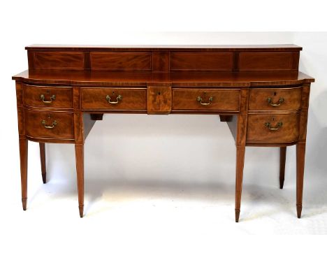 A Regency mahogany crossbanded and satinwood line inlaid bow-fronted breakfront sideboard, with upper shelf above large centr