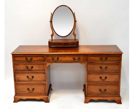 A reproduction yew wood crossbanded and line inlaid nine-drawer kneehole dressing table, 77 x 155 x 47cm, and an associated b