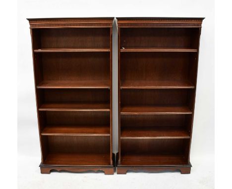 A pair of reproduction mahogany crossbanded and line inlaid open bookcases, the dentil moulded cornice above four adjustable 
