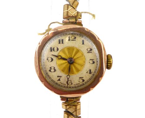 A ladies' vintage 9ct gold watch head, the silvered dial set with Arabic numerals, in a 9ct gold case, crown wind movement, o