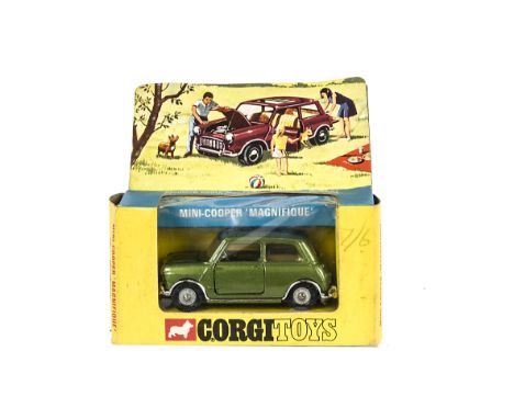 A Corgi Toys 334 Mini Cooper 'Magnifique', metallic green body, cream interior, sunshine roof, cast hubs, in original window 