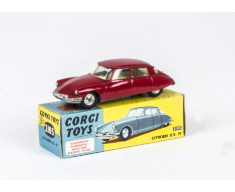 A Corgi Toys 210S Citroën DS 19, red body, lemon interior, spun hubs, in original box, E, box F 