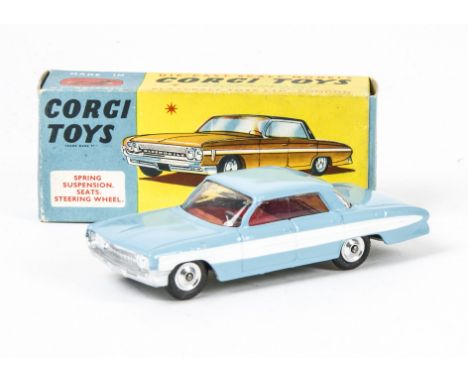 A Corgi Toys 235 Oldsmobile Super 88, light blue body, white side flash, red interior, spun hubs, in original box, E, box G 