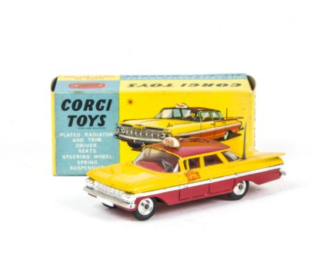 A Corgi Toys 480 Chevrolet Impala Taxi Cab, yellow/red body, red interior, grey aerial, spun hubs, in original box with inner