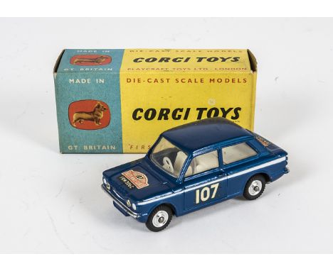 A Corgi Toys 328 Hillman Imp In Monte Carlo Trim, metallic dark blue body, white interior, RN107, spun hubs, in original non 