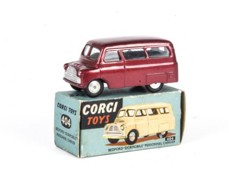 A Corgi Toys 404 Bedford Dormobile Personnel Carrier, metallic maroon body, flat spun hubs, divided windscreen, in original b