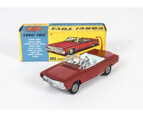 A Corgi Toys 246 Chrysler Imperial, red body, pale blue interior, driver and passenger, golf trolley in boot, detailed cast h