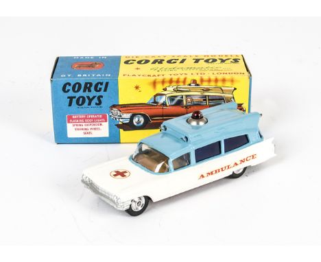 A Corgi Toys 437 Cadillac Superior Ambulance, light blue over white body, 'Ambulance' on sides, red cross to bonnet, in origi