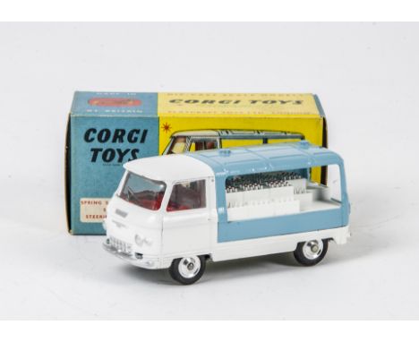 A Corgi Toys 466 Commer Milk Float, white cab, chassis and load, light blue rear, red interior, spun hubs, in original box wi