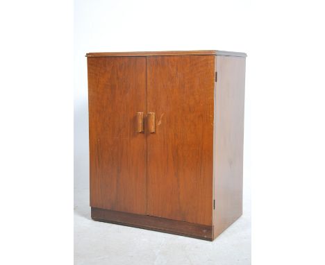 A vintage mid century HMV record cabinet complete with the HMV logo branding to the interior of the door