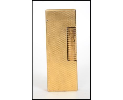 A vintage 20th century Dunhill gilt metal Swiss lighter stamped to base Dunhill 2465.