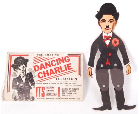 An original vintage British made 'The Amazing Dancing Charlie Illusion' cardboard puppet. With its original cardboard sleeve.