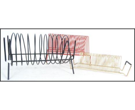 A group of three vintage retro 20th century atomic sputnik record racks for 45rpm record vinyl singles, one in the form of a 
