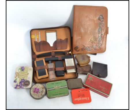 A good collection of vintage advertising / point of sale tins along with vintage leather wares to include vintage wallets and