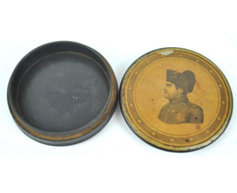 A 19th century circular snuff box, the top with an image of Napoleon, 9cm diameter