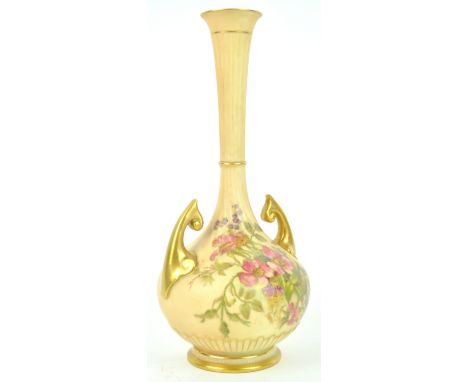 A Royal Worcester blush ivory baluster two handled vase, decorated with a floral spray, 25cm high