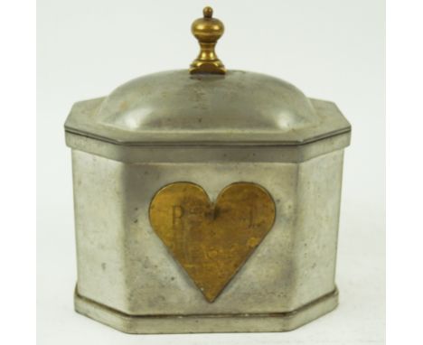 A Dutch Arts and Crafts pewter tea caddy, with brass heart detail, 15.5cm high