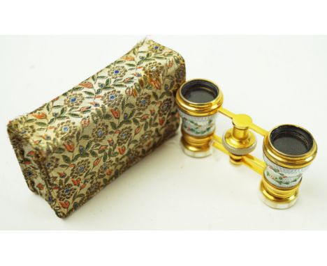 A pair of gilt metal mother of pearl and enamel opera glasses, 7cm high x 9cm wide