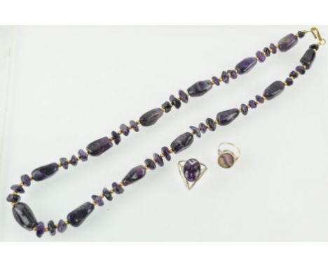 A collection of jewellery to include: A hallmarked sterling silver tablet ring; A single strand of amethyst tumble beads; A w