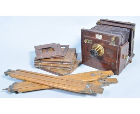 A wet plate camera by Meagher, labelled 'manufacturer 21 Southampton Row, High Holborn, London WC', of mahogany construction,