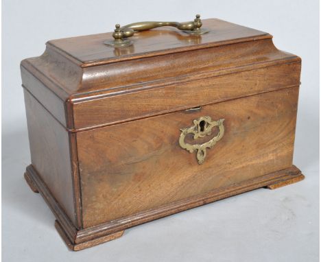 A George III mahogany tea caddy, of rectangular form, with brass swing handle and scroll escutcheon, the moulded hinged top r