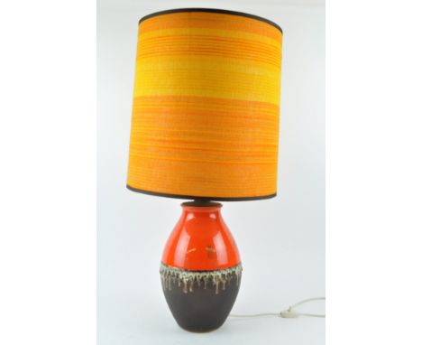 Carstons; a 1960's retro vintage West German pottery lamp, having an orange and brown matte glaze with volcanic glazed band, 