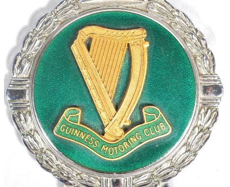 A rare Guinness Motoring Club car badge, stamped for J R Gaunt, London, the gilt harp lettering on a green enamel ground, 12c