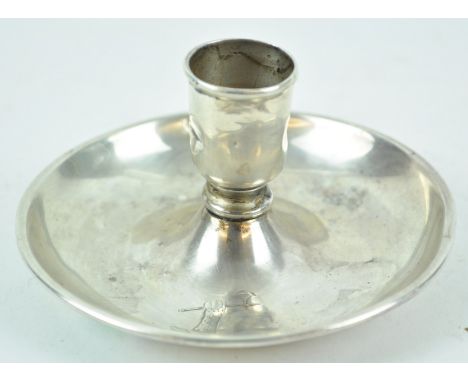 An unusual candlestick, in the form of a go to bed, with no handle, with plain sconce over a dished base, London 1885, 5cm hi