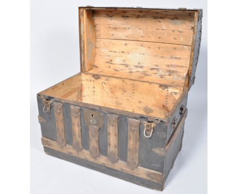 A Continental domed top trunk with oak binding and decorative iron mounts, 54.5cm high x 71cm wide x 43cm deep