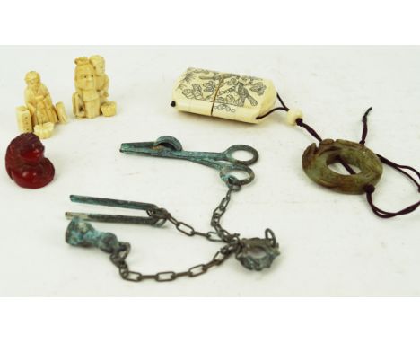 A modern bone inro with erotic scene, 7cm long, together with two carved figures, a modern chatelaine and a resin netsuke (5)