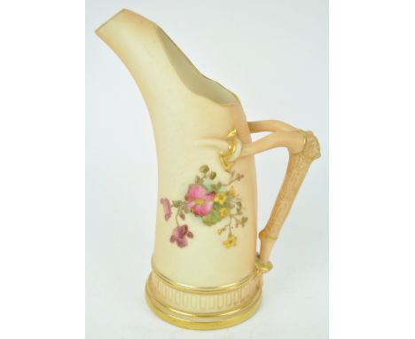 A Royal Worcester blush ivory Tusk style jug, decorated with a floral spray, 