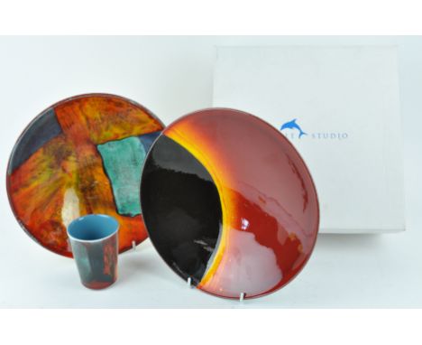 A Poole limited edition Eclipse bowl, No 1071/1999, with certificate, 26.5cm high, together with a Poole bowl and beaker (3)