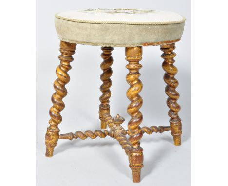 A Victorian stool with tapestry seat on later gold painted barley twist legs, linked by X stretchers, 42.5cm high x 38.5cm di