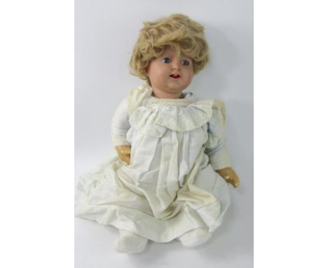 A bisque head doll marked D P Co, 72-11.