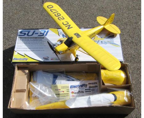 An Electrifly Sci031 R/C model kit, boxed, and a Piper Cub single propeller remote control airplane. (2)