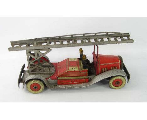 An English tin plate clockwork fire engine, with two firemen and Dunlop tyres, 36cm long.