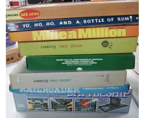 A selection of vintage games, including Subbuteo table soccer, Subbuteo table cricket, Railroader, Phillips mechanical engine