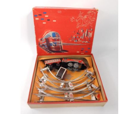 A Distler battery operated train set, the engine named The Flyer, sold with tender, carriage, some track, in original box wit
