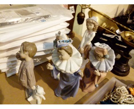 Five Nao figures including three clowns 