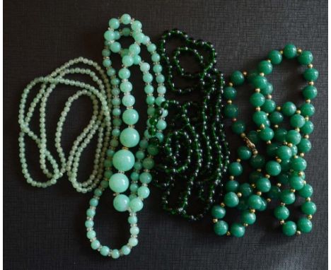 A Jade Graduated Bead Necklace, together with three other similar necklaces 