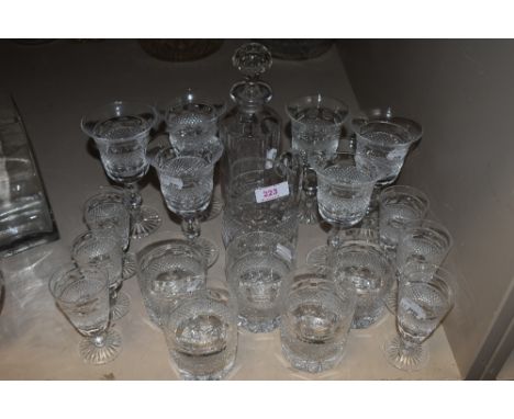 A shelf full of vintage Cumbria Crystal glasses, a decanter, and jug in the Grasmere design, around nineteen items.
Condition