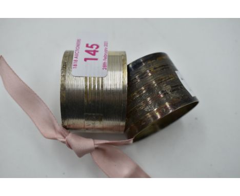 Two HM silver napkin rings having engine turned stripe decoration