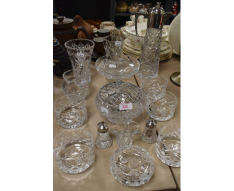 A collection of glassware amongst which are a decanter with plated handle, rose bowls and cruet.