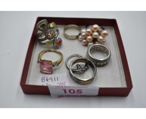 Seven assorted white metal dress and band rings stamped 925 including multi pearl, cubic zirconia, Tiffany style etc