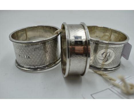 Three HM silver napkin rings, all having engine turned decoration, approx 76g