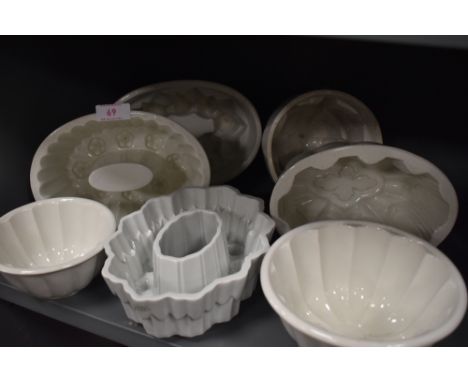 Seven vintage ceramic jelly moulds.
